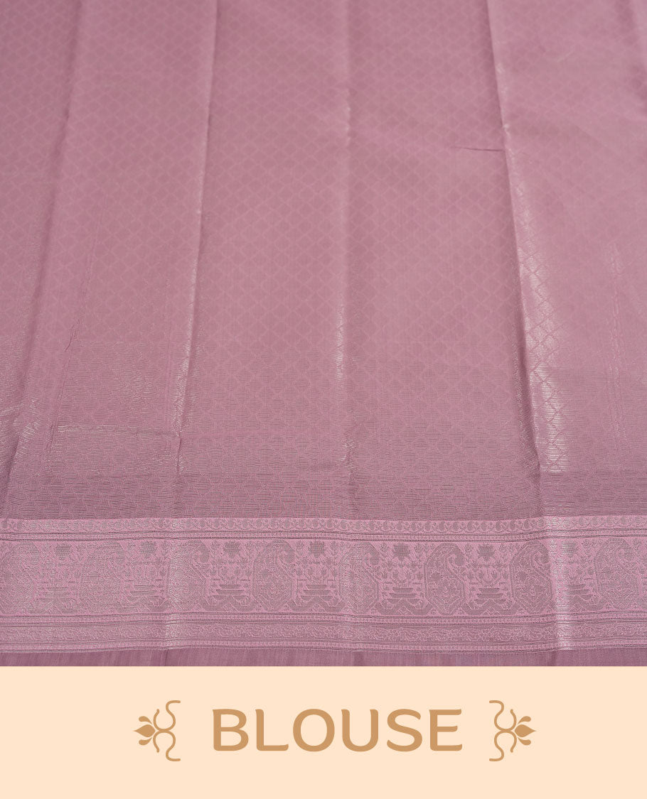 Navy blue colour semi silk saree adorned with silver zari motifs on the body, complemented by a pastel pink pallu intricately woven with rich floral patterns border and pallu, and paired with a matching blouse