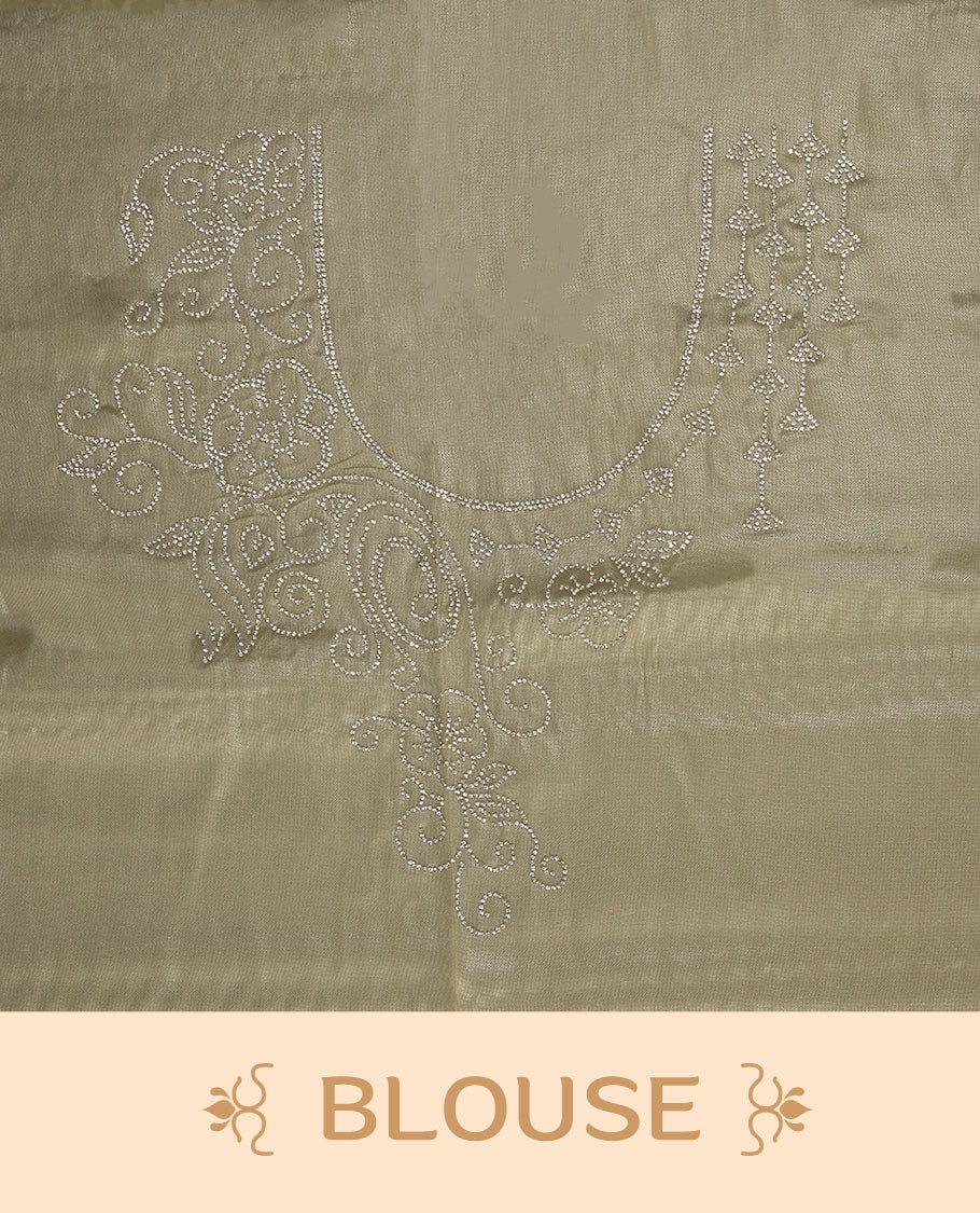 Pale yellow colour net shimmer fancy saree adorned with scattered white stone buttas all over the body, paired with a delicate stone worked border and matching blouse.