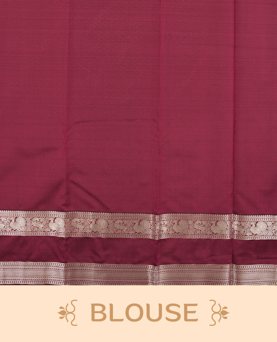 Maroon colour semi soft silk saree featuring a gold floral patterned body, complemented by gold traditional pallu & border and a matching blouse piece.