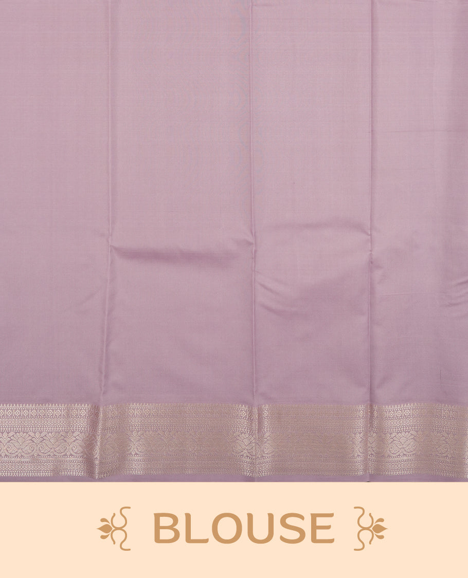 Lavender colour semi soft silk saree featuring a golden textured patterned body, complemented by self coloured golden traditional motifes on pallu & border and a matching blouse piece.