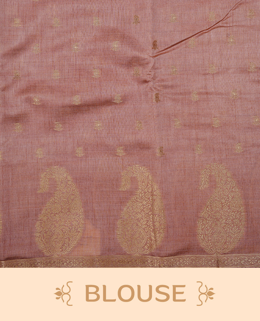 Salmon pink colour semi tussar silk saree featuring small gold zari mango motifs across the body, enhanced with a self colour border showcasing elegant gold zari mango patterns. Paired with a matching blouse piece.