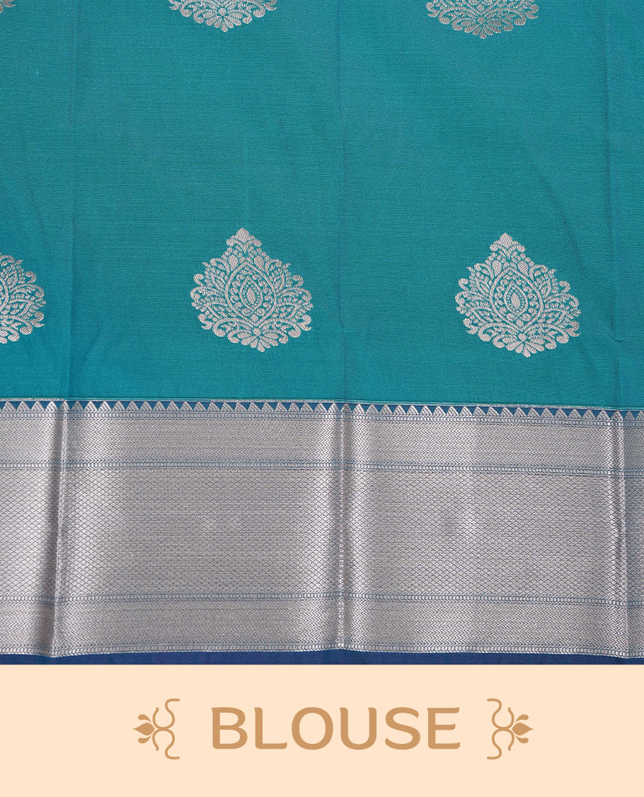 Green colour Semi silk saree Featuring gold zari motifs on body, complemented by contrast Teal colour with gold zari border, paired with matching blouse piece.
