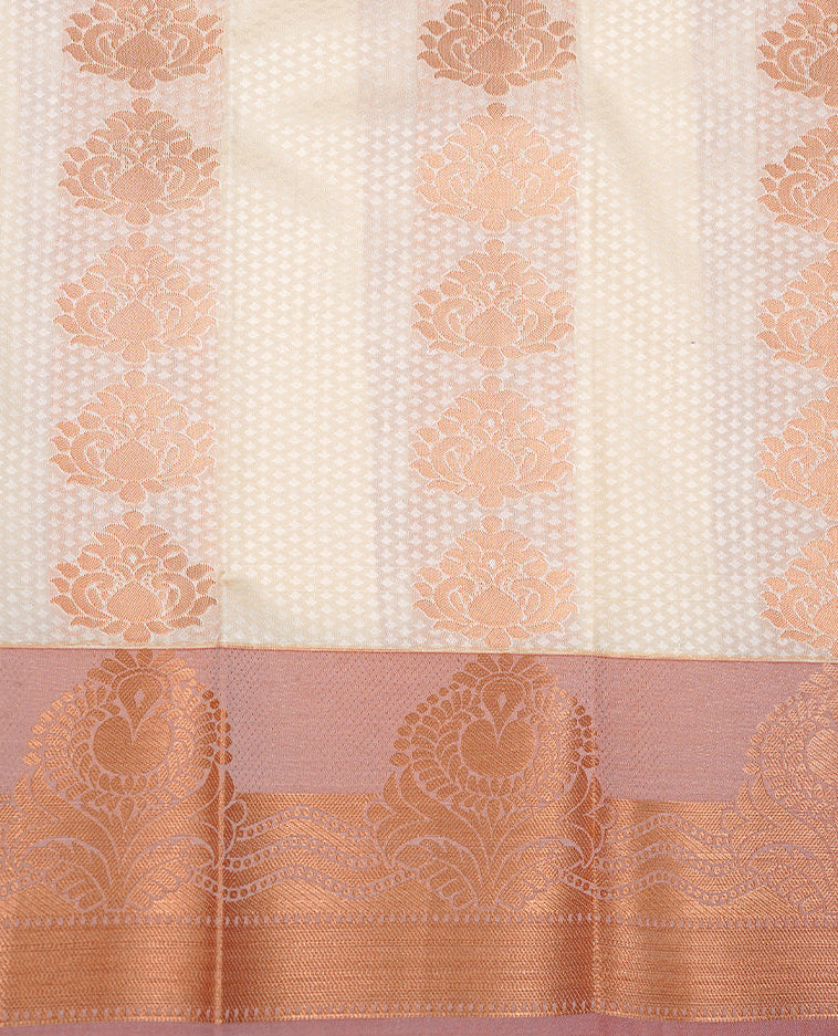 Off white colour Semi silk saree Featuring gold zari motifs on body, complemented by contrast pale orange colour with gold zari border, paired with matching blouse piece.