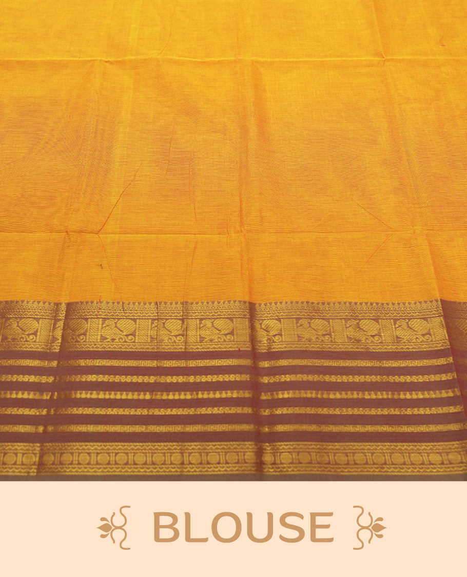 Marigold colour Silk Cotton Saree with Rich Maroon Zari Borders Showcasing Traditional Peacock and Floral Panels, Multiple Horizontal Zari Lines on the Pallu, and a Coordinated Matching Blouse Piece