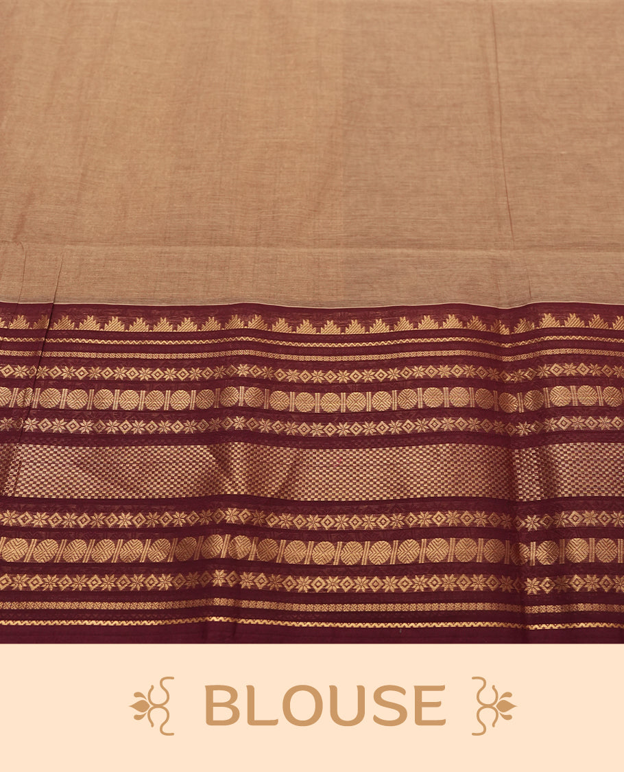 Beige Colour silk cotton saree with scattered maroon and black buttas, ornate maroon and gold zari border with geometric patterns, gold zari pallu with diamond lattice, plain beige blouse with maroon border.