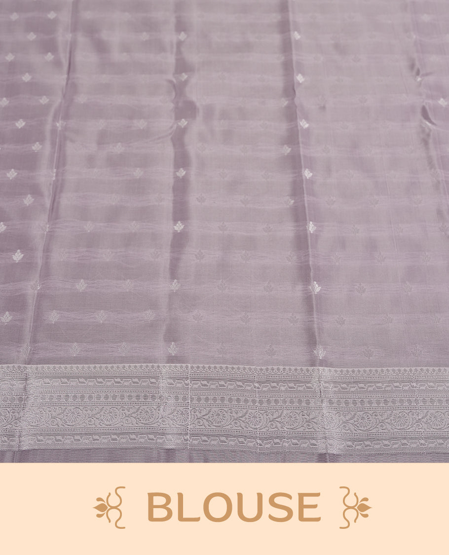 Light Lavender Colour Silk Saree with Allover Subtle Floral Self-Weave, Contrasting Silver Zari Woven Pallu and Border with Intricate Patterns and Tassels, Paired with Matching Blouse Piece