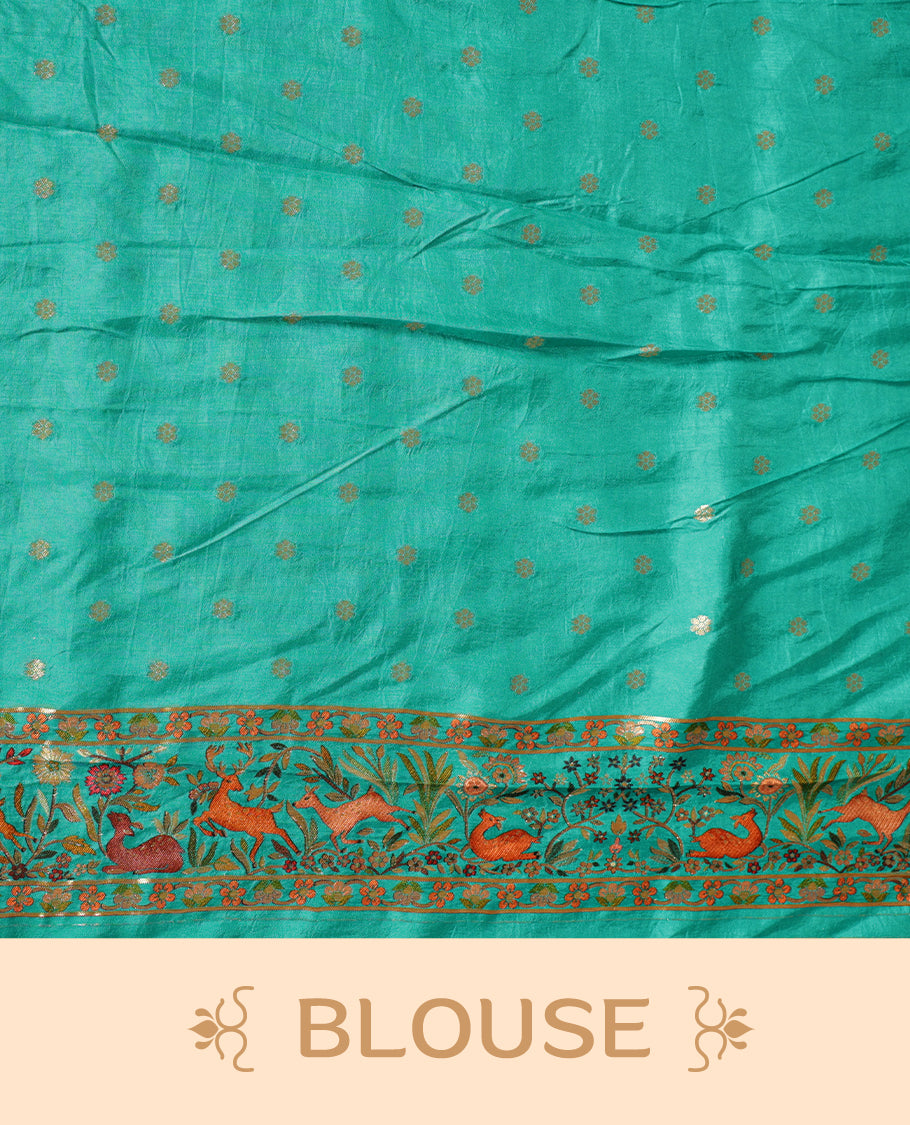 Turquoise sea green colour Pashmina silk saree lavishly adorned with all‑over woven wildlife and forest motifs, framed by an intricately detailed animal & floral zari border and grand storytelling pallu, paired with a matching woven border blouse piece.