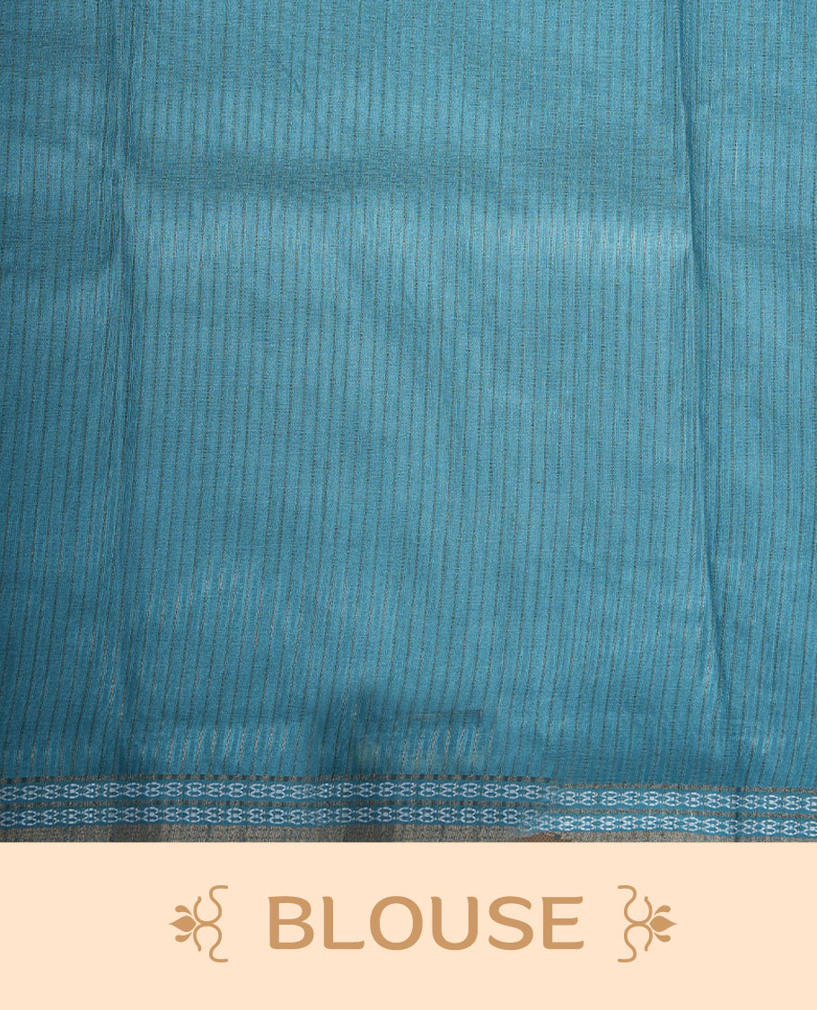 Teal blue colour semi tussar silk saree featuring an abstract floral printed body with a rich self border and tasselled pallu, paired with a matching blouse.