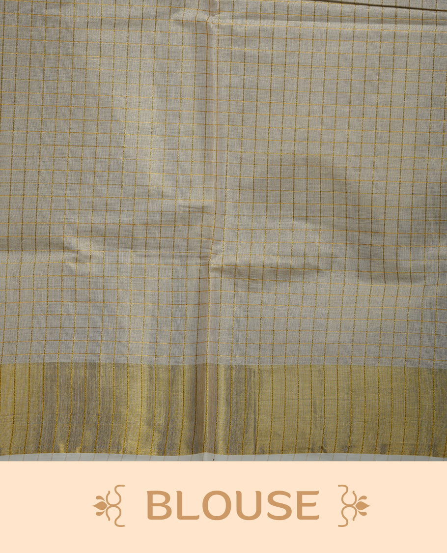 Off white colour Tissue Kerala saree featuring a subtle checked body, a refined golden zari border, and a traditionally woven pallu, paired with a matching blouse.