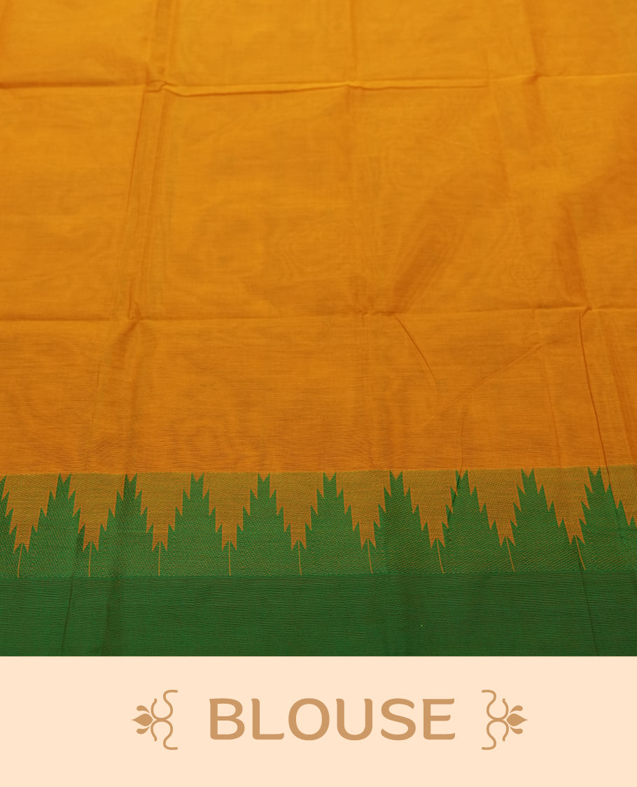 Burnt Mustard Colour silk cotton saree with tiny emerald thread buttas, temple green serrated borders, a pallu lined with green stripes, paired with a plain burnt mustard blouse featuring the same temple green border