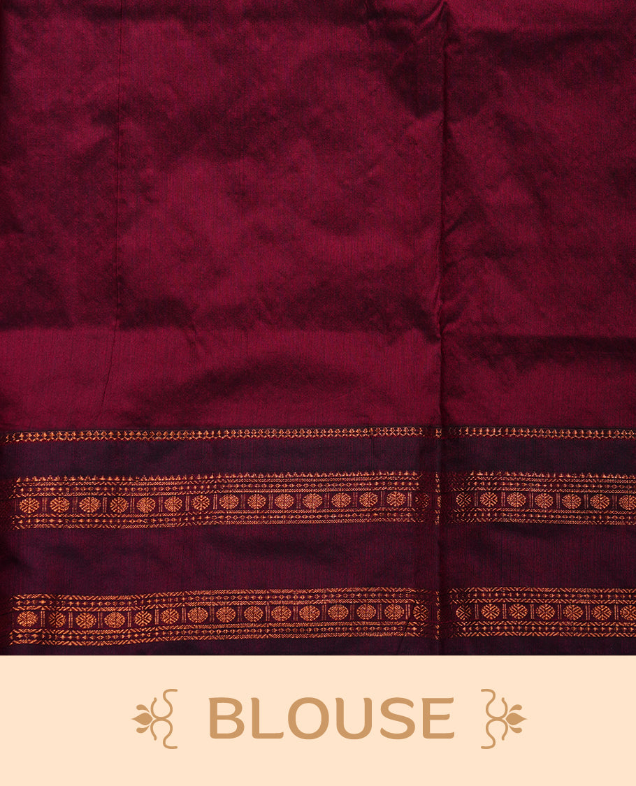 Royal blue colour saree with subtle zari motifs, complemented by a rich maroon zari border and traditional pallu, paired with a matching blouse.
