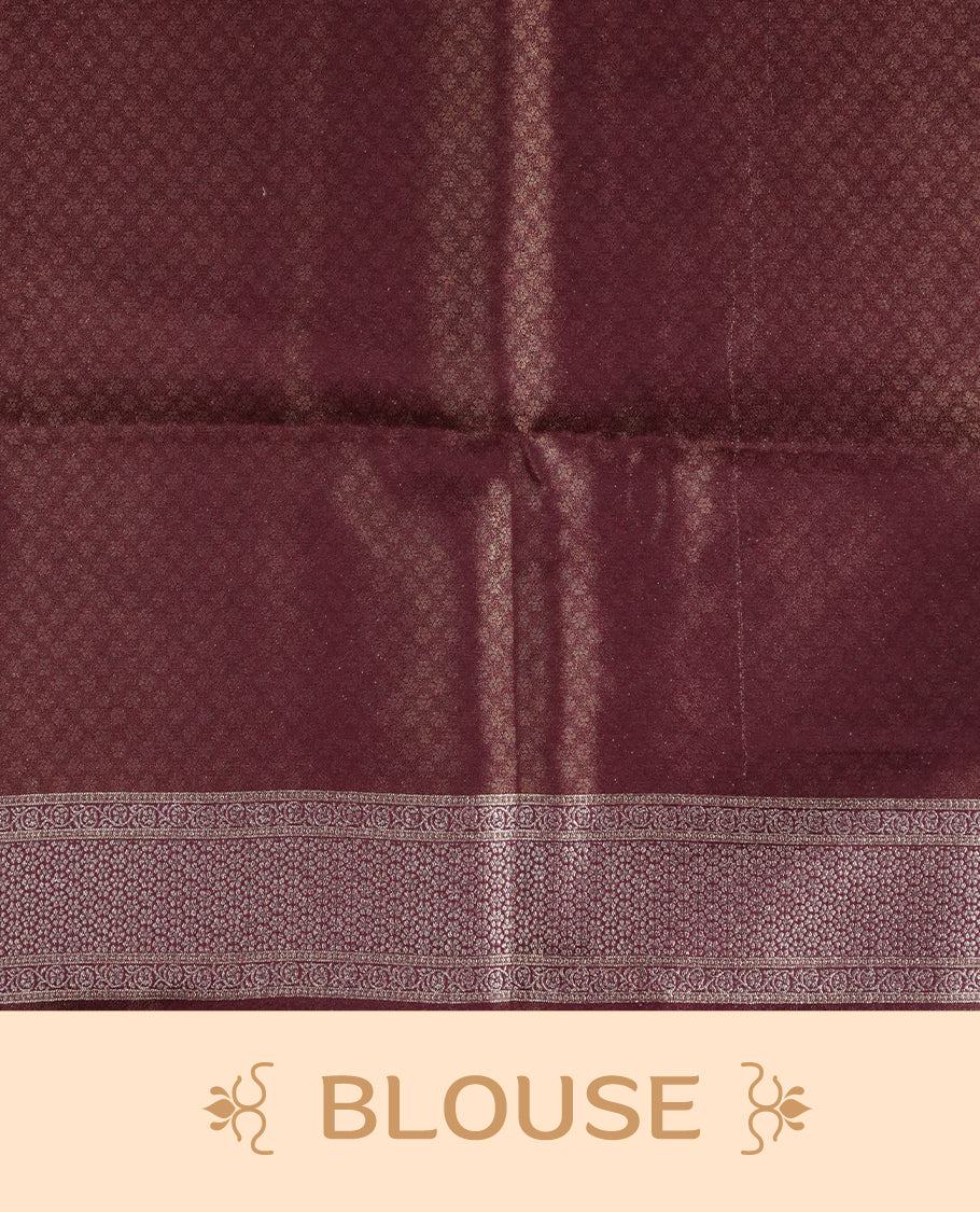 Maroon colour Mulberry silk saree featuring Gold zari buttas on body, complmented by self colour with Gold zari dual peacock in Temple design border, comes with matching blouse piece.