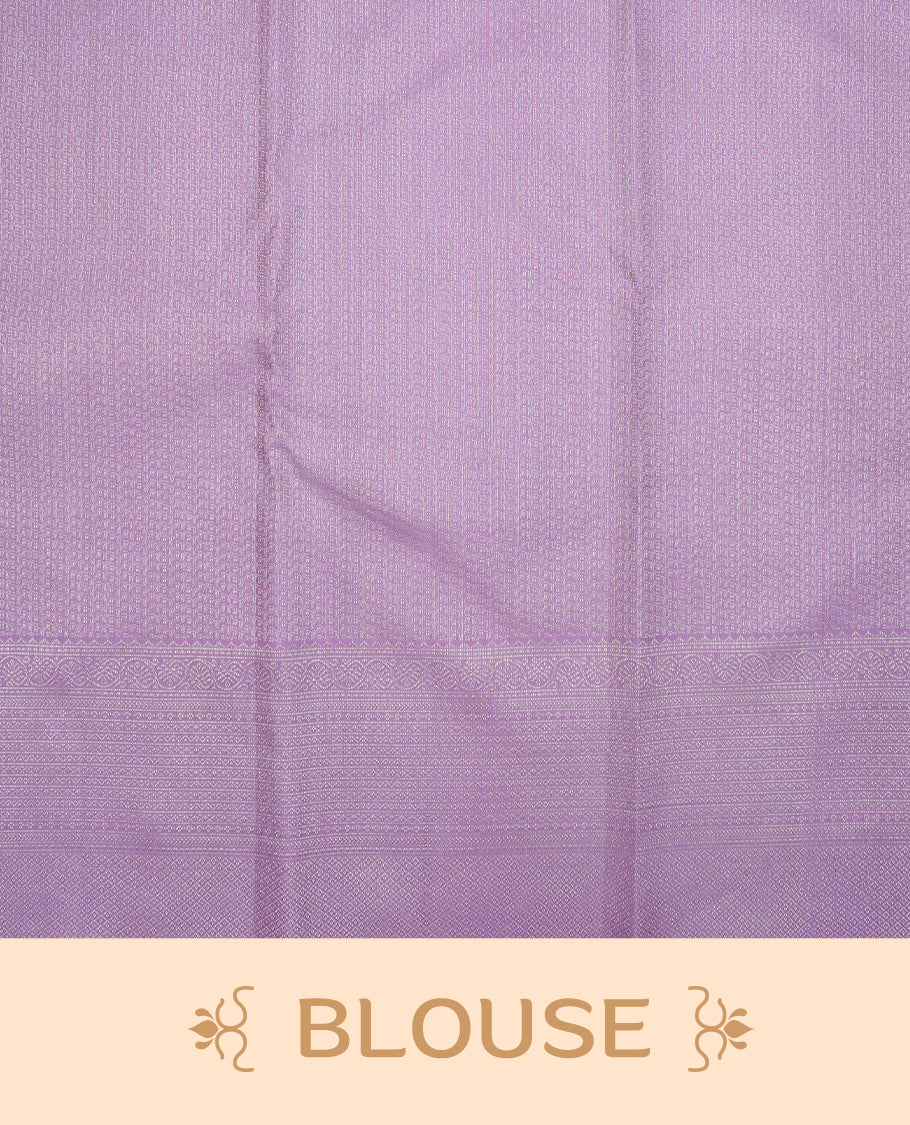 Lavender colour pure wedding silk saree featuring Silver zari Floral kodi pattern on body, complemented by self colour with traditional border, comes with matching blouse piece.