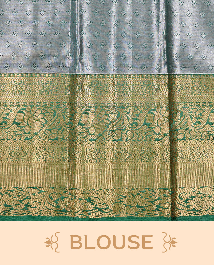 Ice Blue Colour Tissue saree Featuring Light gold Floral kodi Pattern on body, enhanced with contrast Green colour with gold zari border, paired with matching blouse piece.