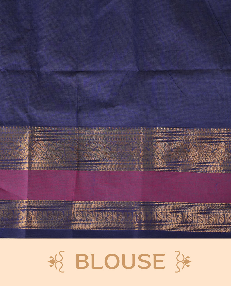 Navy blue colour chettinad cotton saree featuring gold zari stripes on body, complemented by magenta with gold zari border, paired with matching blouse piece.