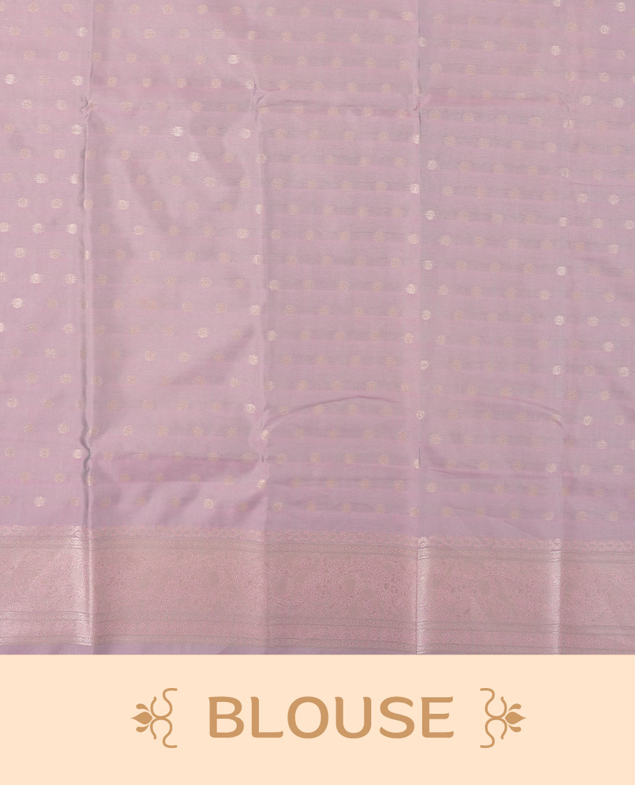 Dusty Lilac Semi Silk Saree with Subtle Zari Butta Motifs, Matching Pastel Lilac Zari Woven Pallu and Border with Intricate Floral Patterns and Tassels, Paired with Coordinated Blouse Piece