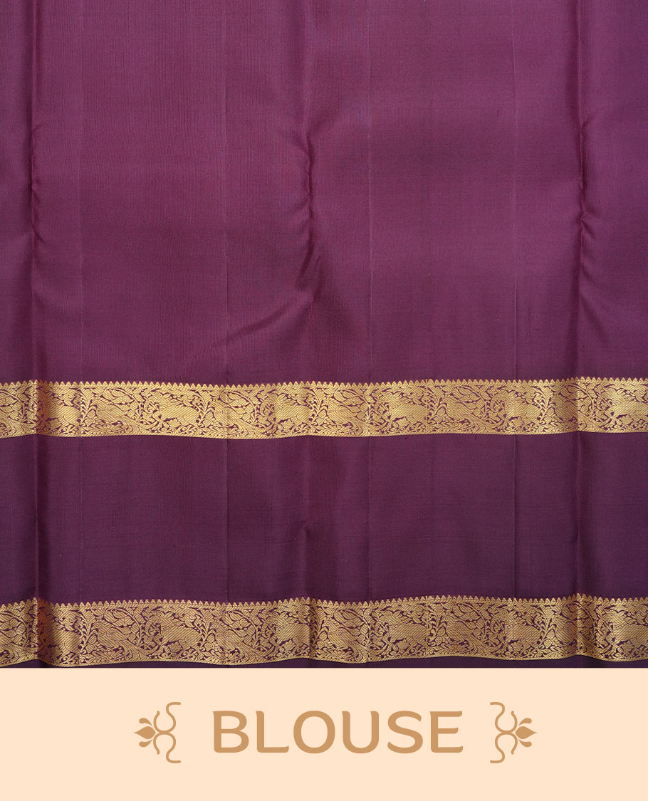 Pinkish grey colour traditional kancheepuram silk saree featuring gold zari chakram & Peacock motifs on body, complemented by contrast Purple colour with Gold zari border, comes with matching blouse piece.