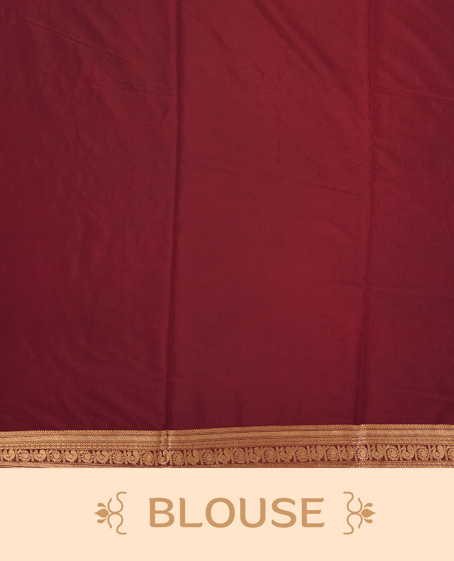 Red colour mysore crepe saree with gold zari check pattern on body, complemented by contrast Brown colour border featuring peacock and chakkram motifs, paired with matching blouse.