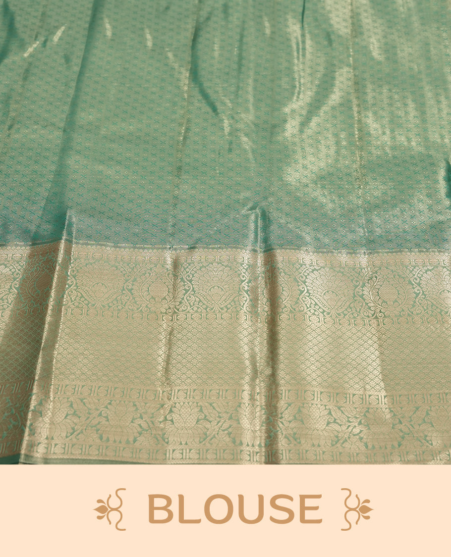 Seafoam green and Antique gold Zari Tissue Brocade Saree features intricate floral Motifs on body and traditional border & pallu with floral patterns, paired with matching blouse