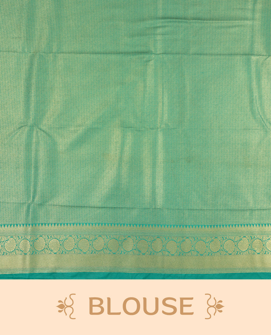 Dark Blue colour semi silk brocade saree featuring intricate Gold Floarl kodi patterns across the body, complemented by a contrast rich Aqua green colour woven border and pallu, paired with a matching blouse.