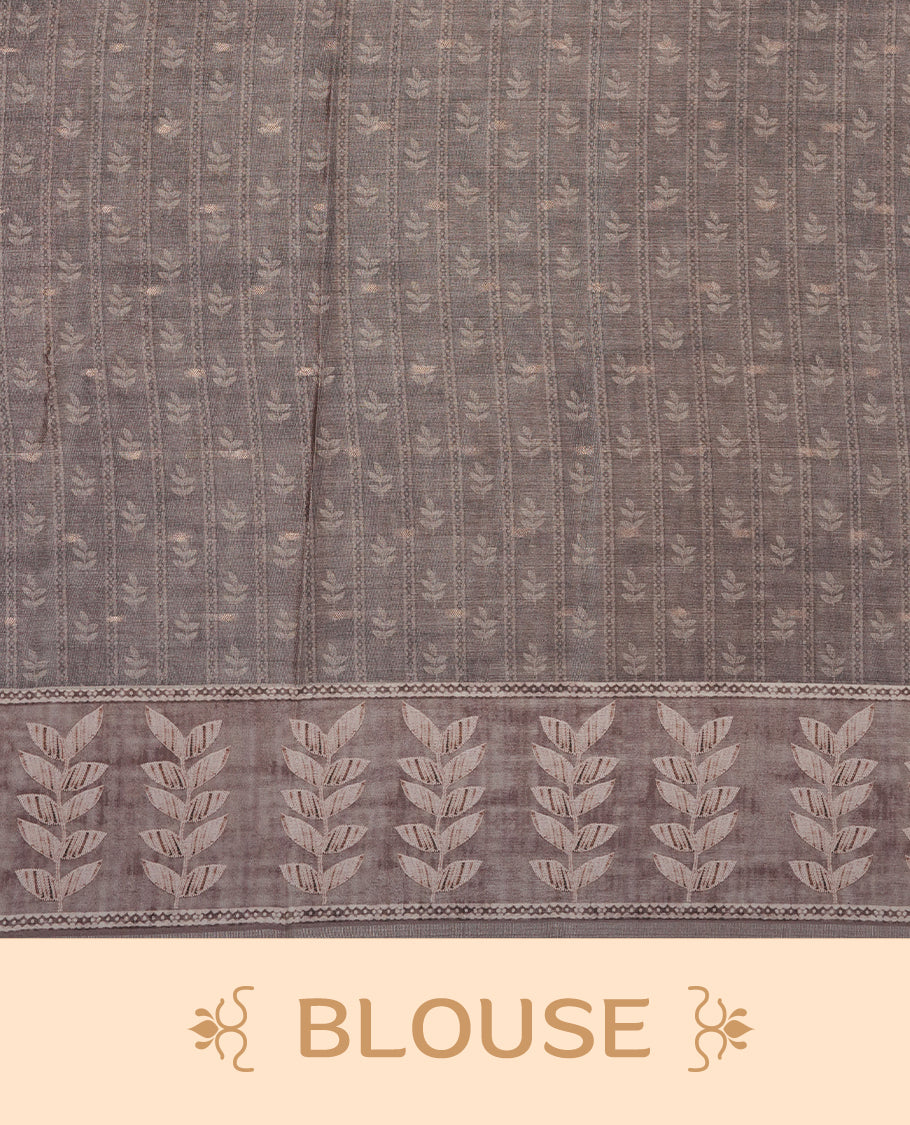 Pink copper colour semi tussar saree adorned with Cream Zigzag printed pattern across the body and Leaf pattern on border, paired with a matching blouse.