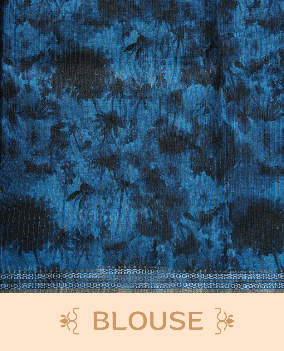 Sky blue colour semi tussar silk saree featuring a dreamy abstract digital floral printed body, finished with a rich self border and tasselled pallu, paired with a matching blouse.