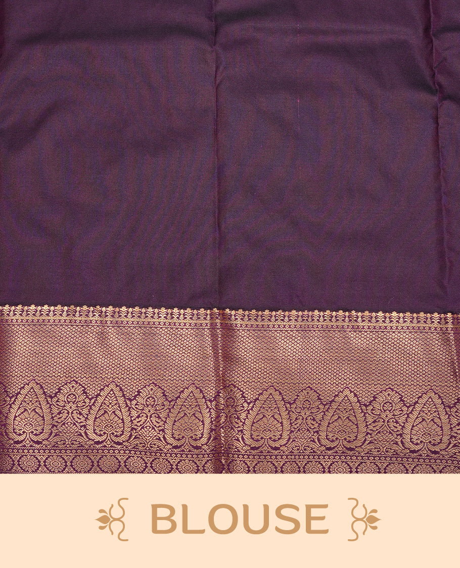 Yellow colour semi Wedding silk saree featuring Gold zari motifs on body, enhanced with Contrast Purple colour with traditional border, paired with matching blouse piece.