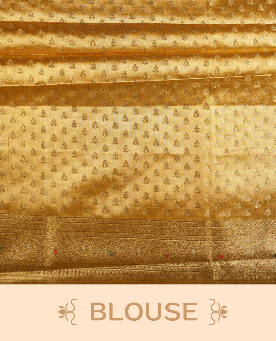Yellow Gold colour tissue banaras silk saree featuring antique gold zari motifs on the body with rich traditional zari border and pallu, paired with a matching blouse piece.