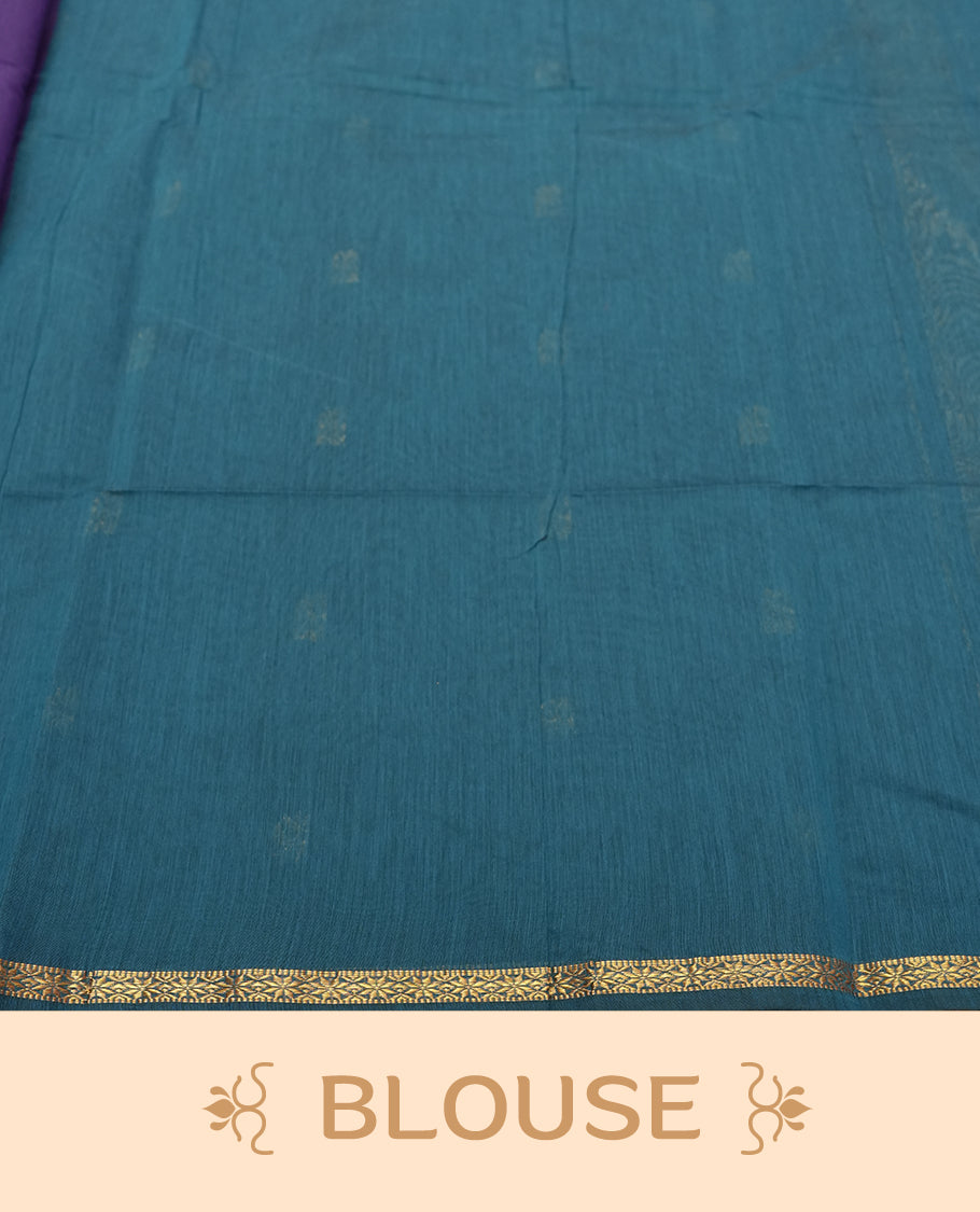 Teal Blue Colour silk cotton saree featuring small zari buttas on the body, contrast purple section, zari pallu, and matching blouse with border detailing.