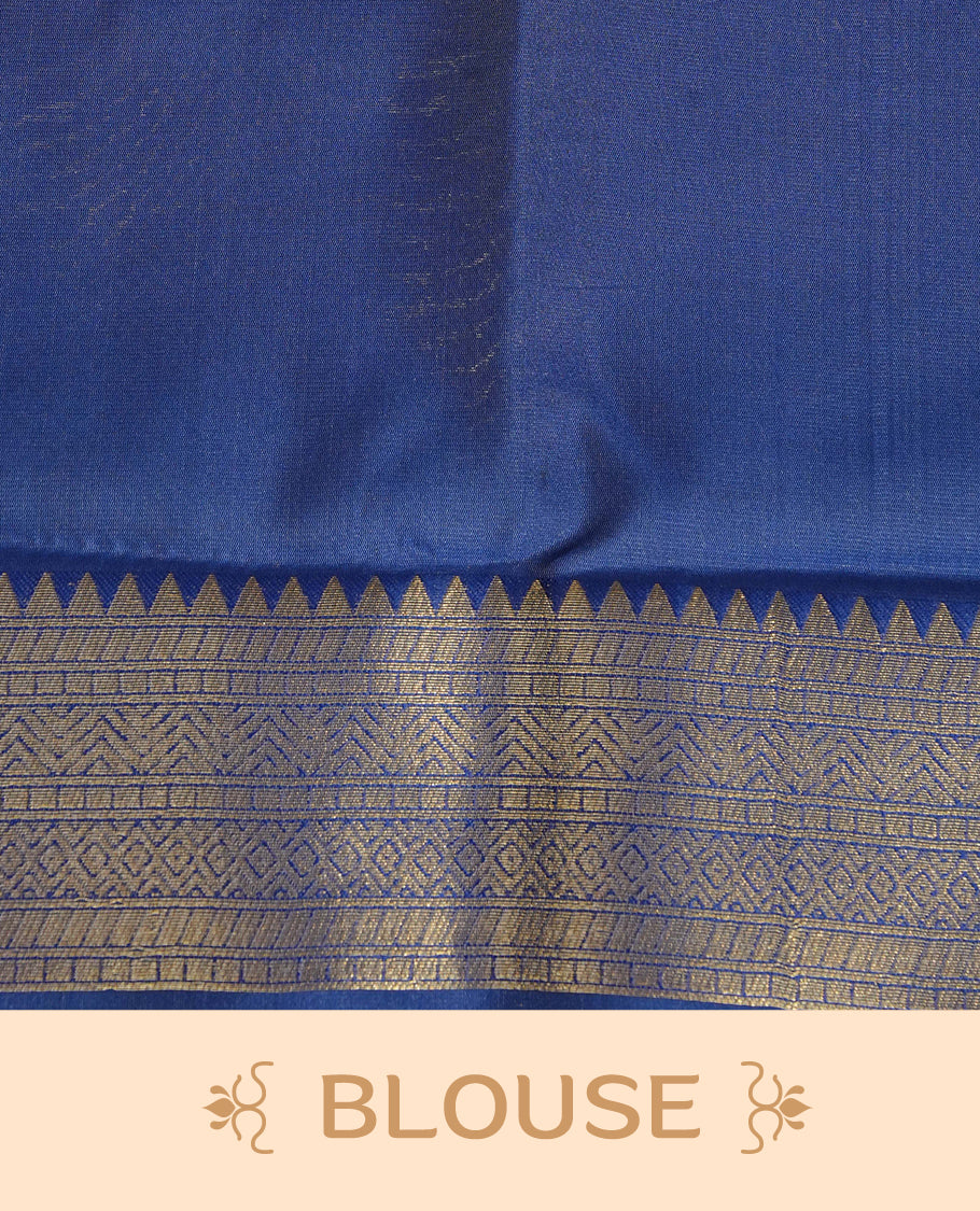 Cream Colour Semi Soft Silk Saree Featuring Gold zari Patter On Body, Highlighted  by contrast Dark Blue border with Gold zari, paired with matching blouse piece.