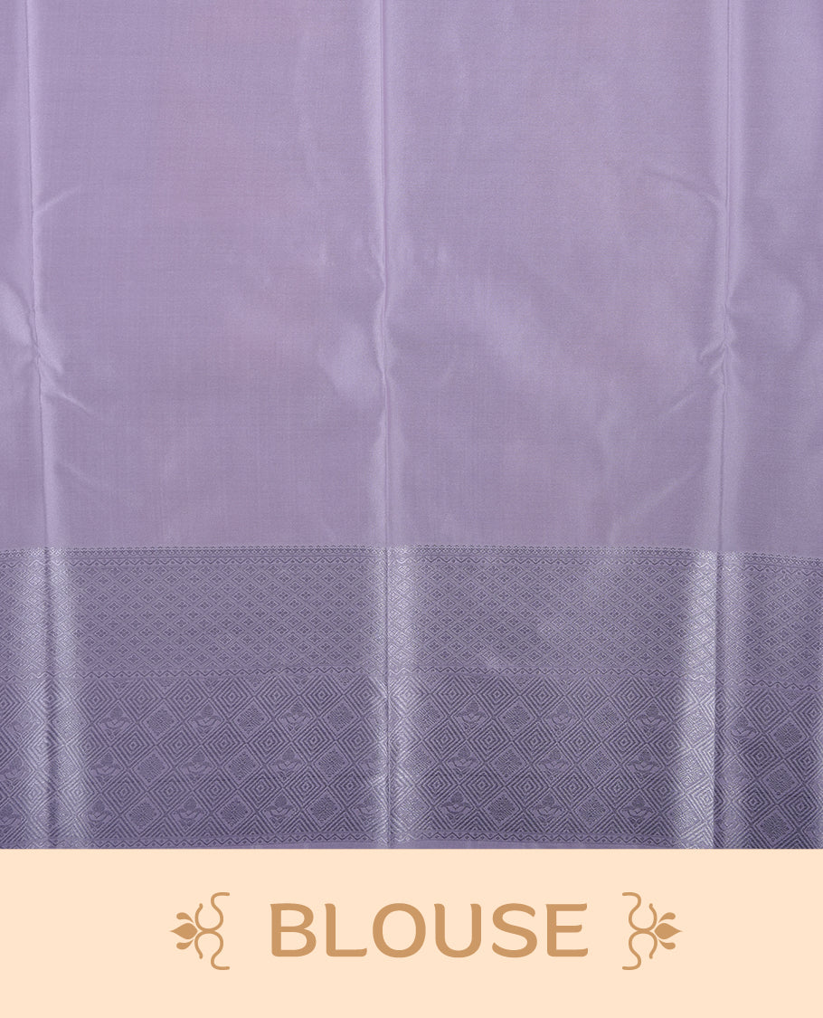 Lavender & cream colour semi soft silk saree featuring a silver zari patterned body, complemented by silver zari motifes on pallu & border and a matching blouse piece.