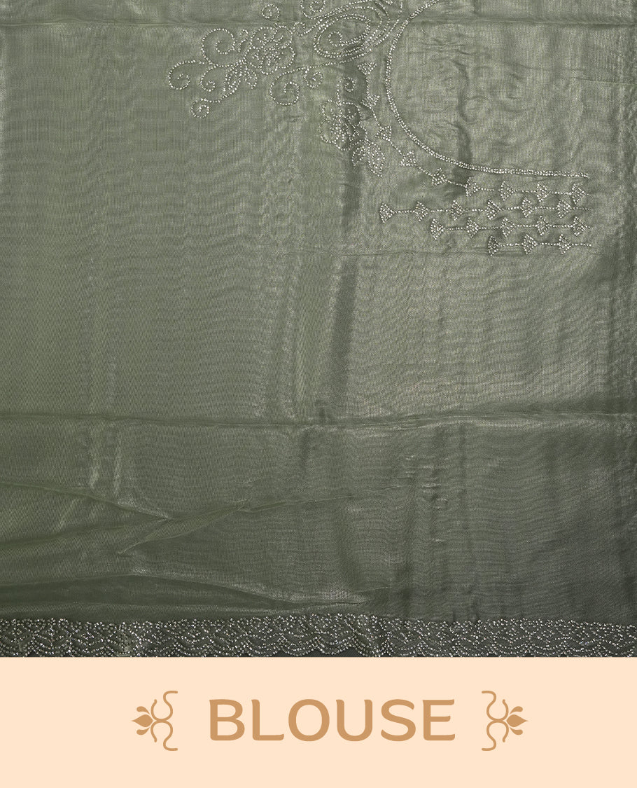 Mint Green Colour net shimmer fancy saree adorned with strip white stone buttas all over the body, paired with a delicate stone worked border and matching blouse