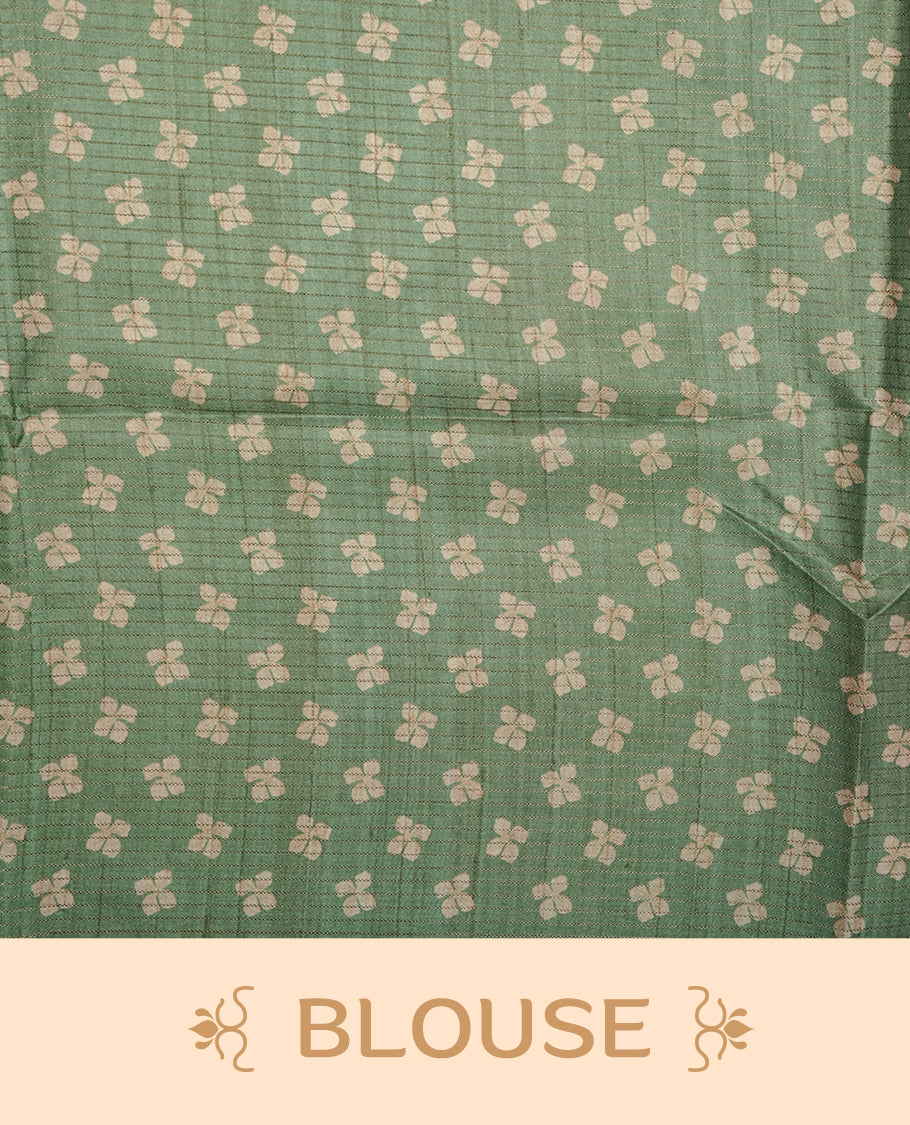 Light green colour semi tussar silk saree featuring geometric print and gold zari check pattern across body, contrast green colour border and pallu, paired with matching blouse piece.