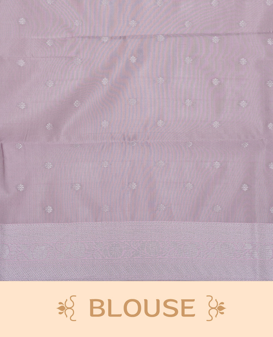 Green colour semi silk saree featuring Silver zari Geometric pattern on body, complemented by contrast pink colour with silver zari border, comes with matching blouse piece.