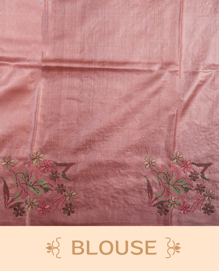 Pastel peach colour Pure tusser silk saree featuring finely crafted floral thread embroidery detailing on the border, pallu and with matching blouse piece.