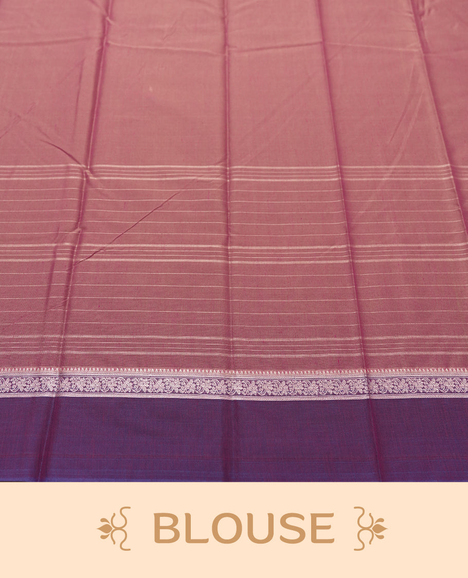 Rose Mauve and Royal Purple Colour silk cotton saree with Warli dancer pallu, subtle pinstripes and pastoral buttas on the body, floral zari border along the purple edge, and a coordinated Rose Mauve blouse with border.