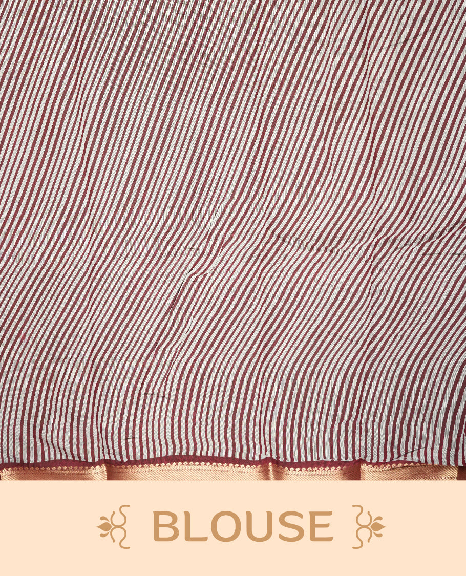 Maroon colour chanderi cotton saree with plain body, geometric tribal printed pallu with golden zari border, and diagonal striped blouse.