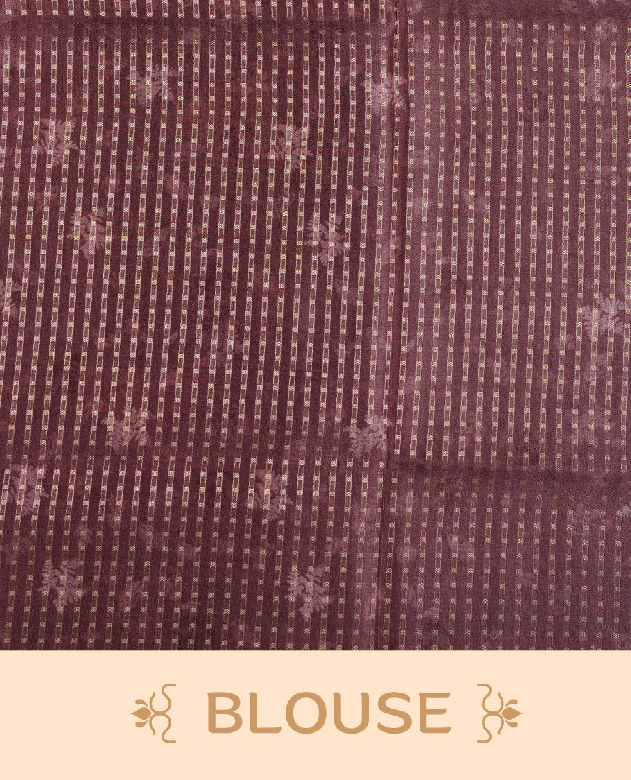 Brown colour tussar saree featuring woven Eco leaves printed on the body, complemented by a self colour gold zari bindi butta border & pallu, paired with a matching blouse.