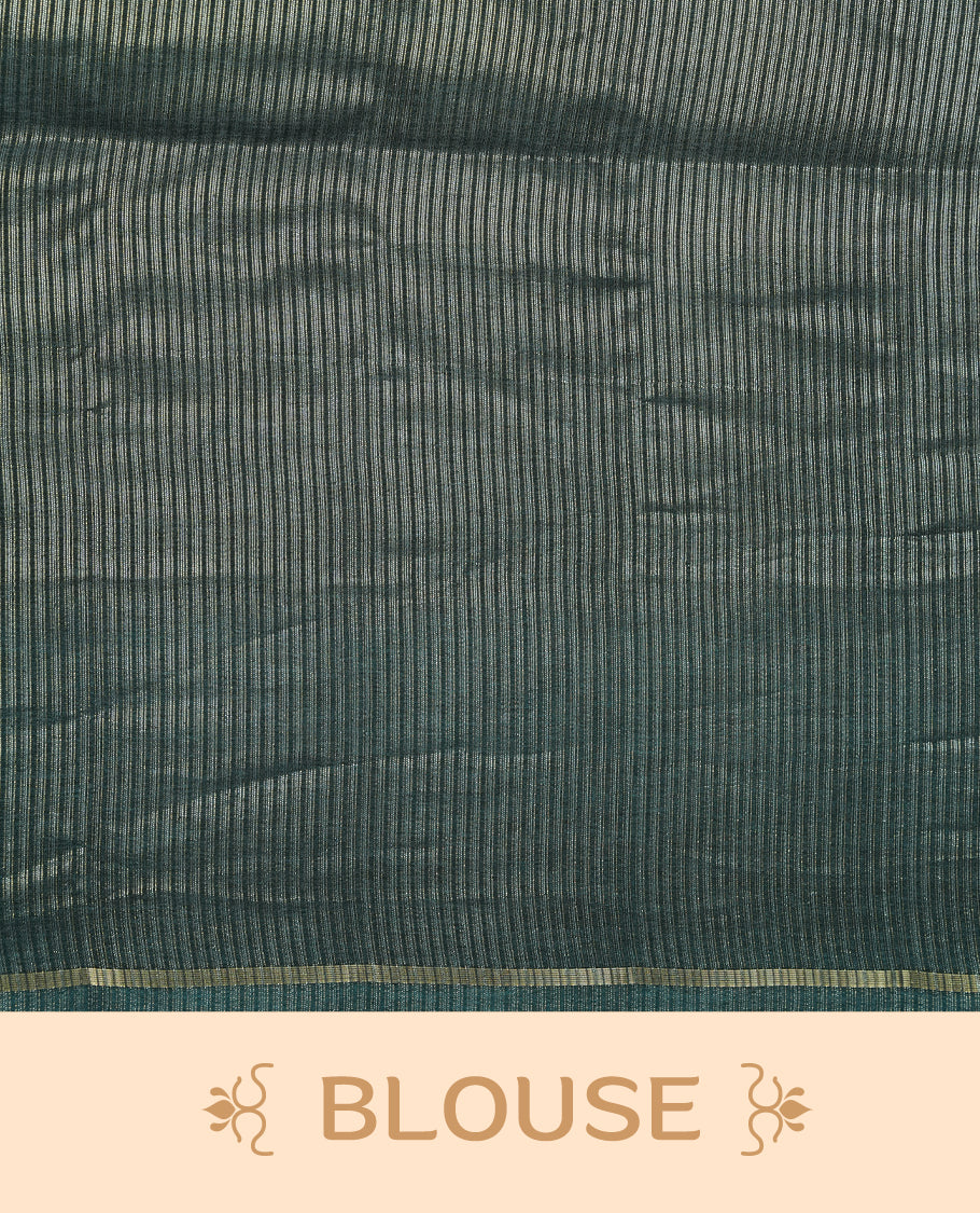 Teal colour semi tussar silk saree highlights gold and silver zari stripes across body,  border, pallu and paired with matching blouse piece.
