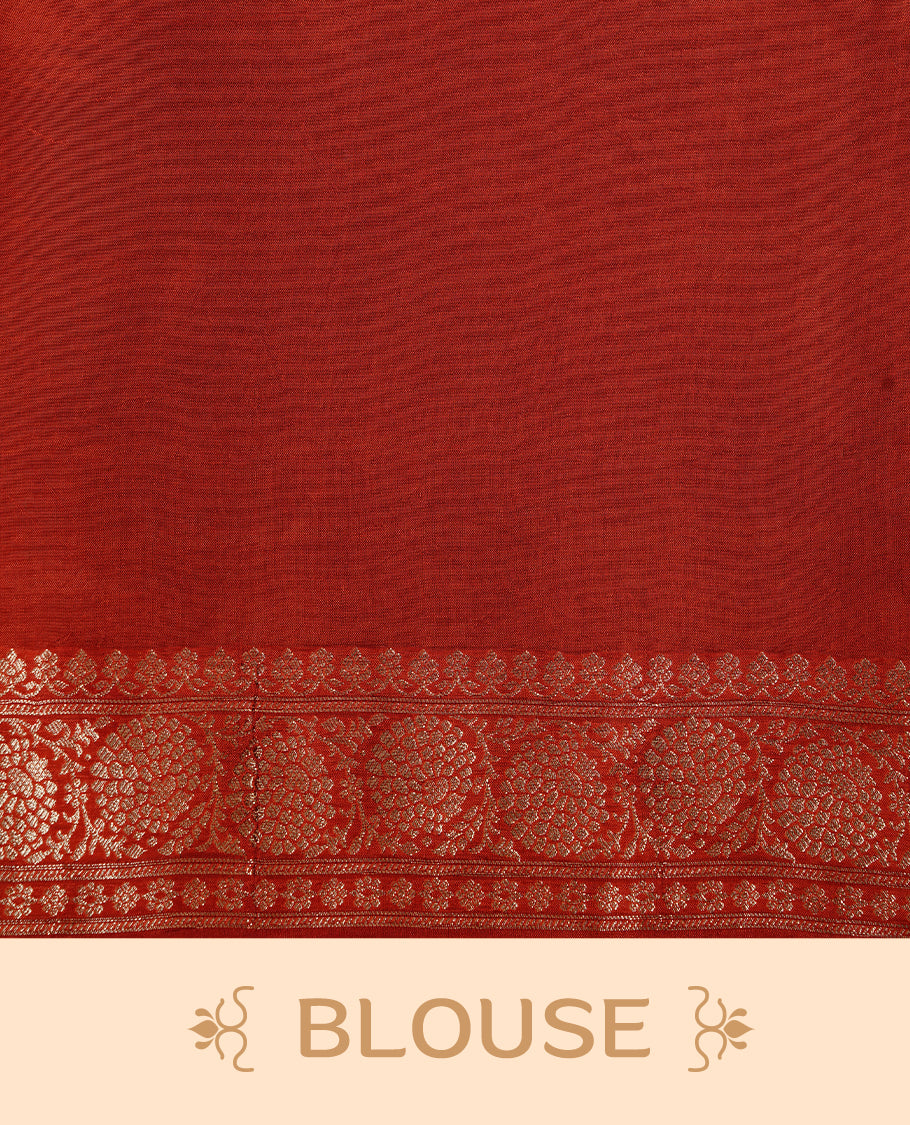 Brick red colour banaras crepe saree featuring gold & silver zari design stripes on body, complemented by self colour border, paired with matching blouse piece.