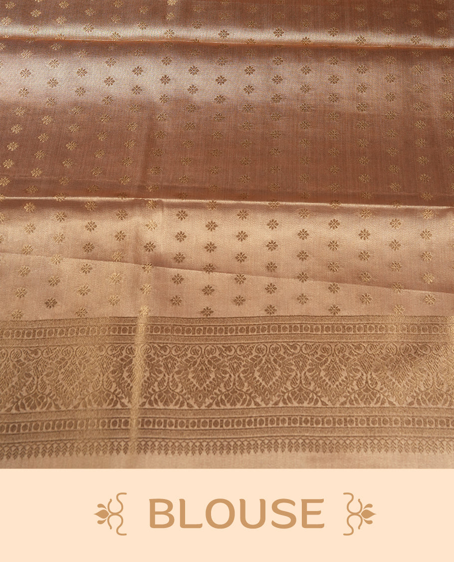 Gold colour tissue banaras silk saree featuring antique gold peacock zari motifs on the body with rich traditional zari border and pallu, paired with a matching blouse piece.