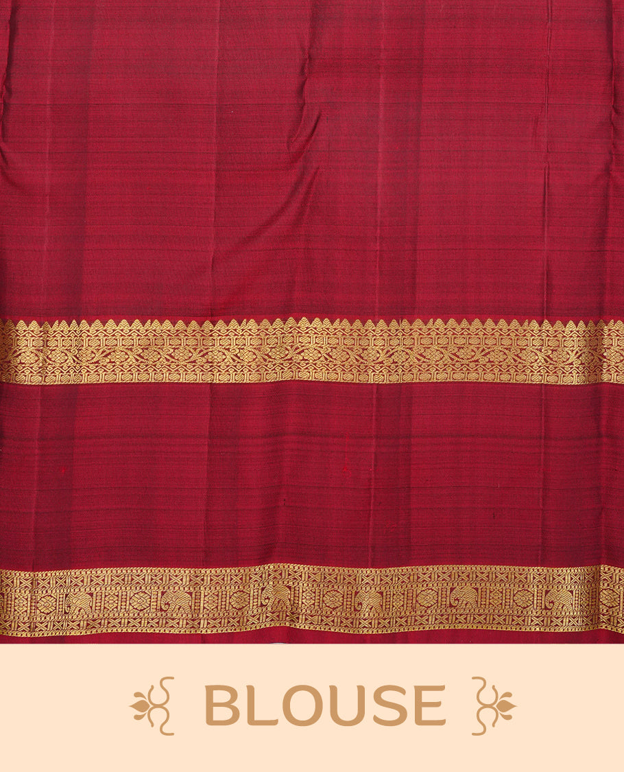 Bottle green colour traditional kancheepuram silk saree featuring gold zari buttas on body, contrast Maroon colour Border, comes with matching blouse piece.