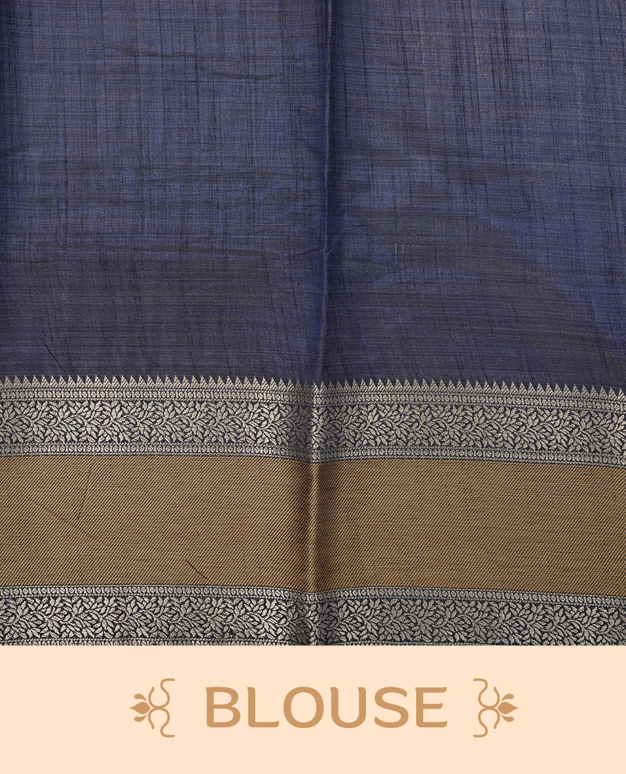 Light gold colour tussar saree featuring Elegant plain body, complemented by contrast Navy blue colour with Gold zari Floral kodi with Elephant Pattern border, comes with matching blouse piece.