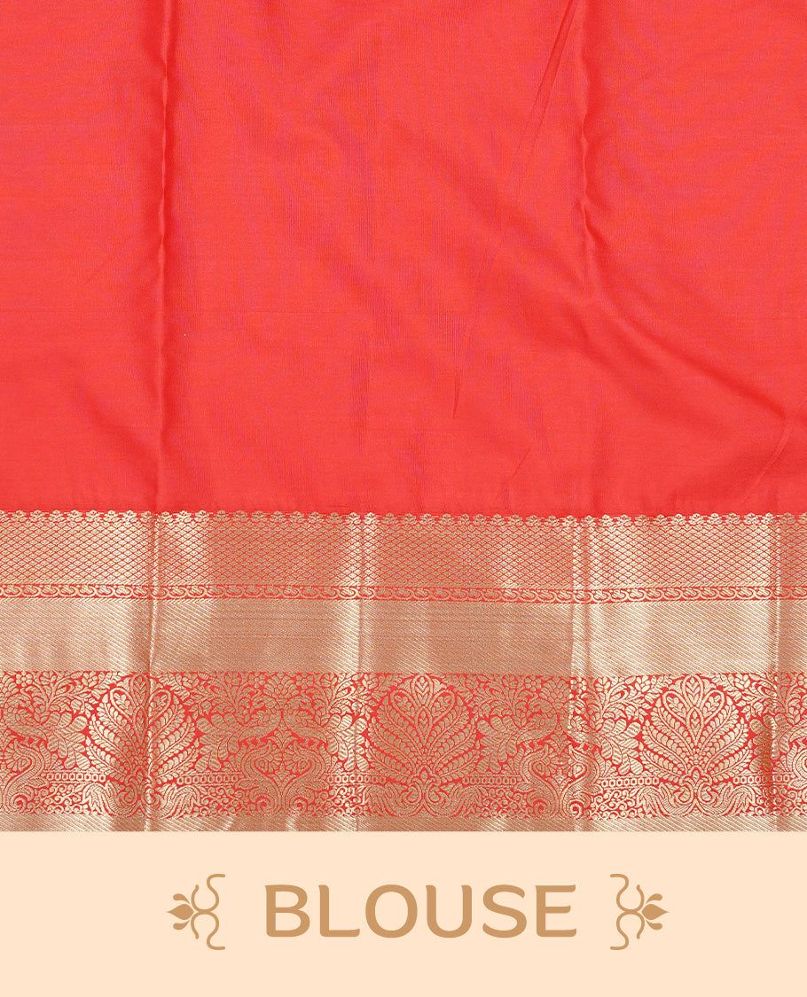 Red Colour semi wedding silk saree featuring Gold zari leaf motifs on body, complemented by Traditional zari on self colour border with green colour piping, paired with matching blouse piece.