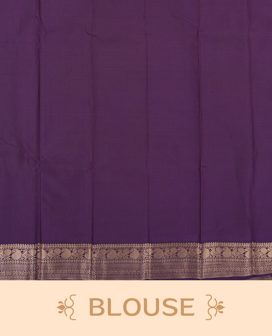 Yellow colour Semi Silk Saree with gold zari striped patterns on the body, paired with a contrasting dark purple colour traditional pallu and border, and a matching blouse piece.