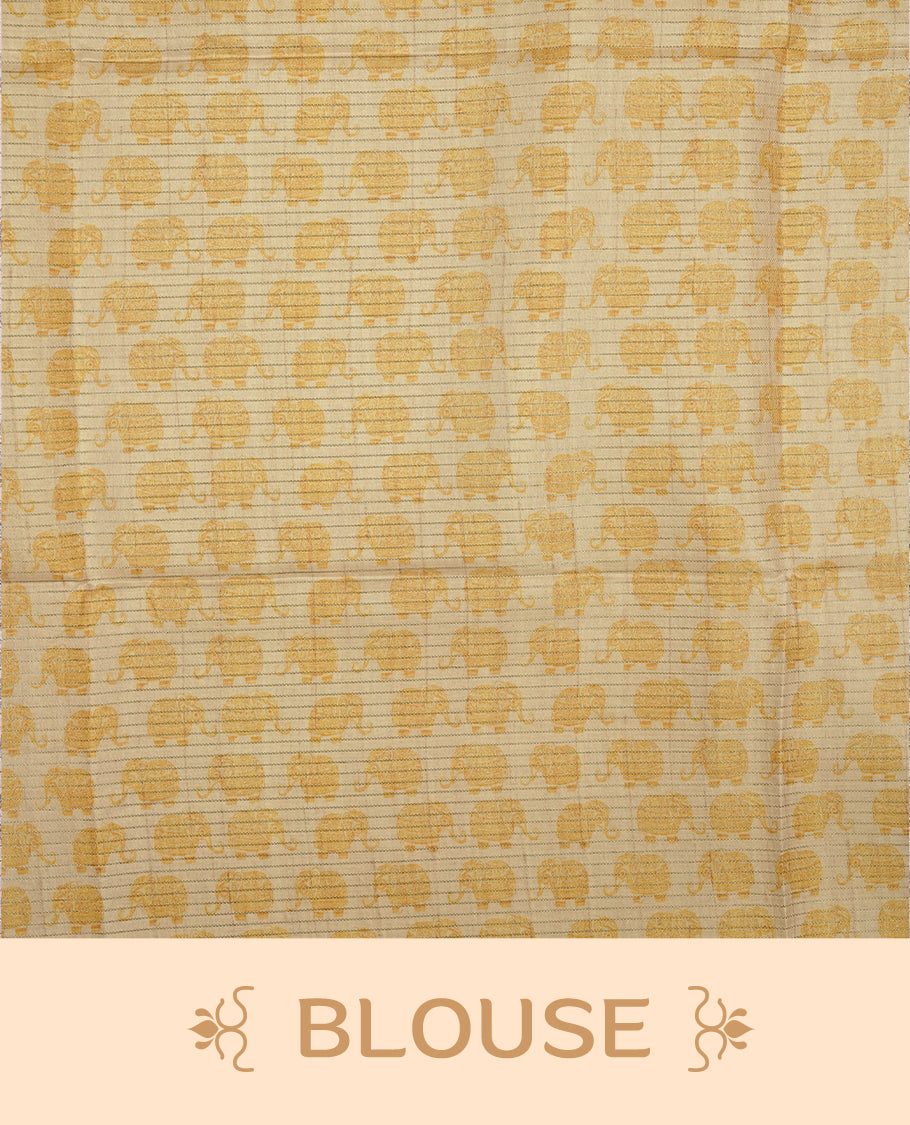 Golden yellow colour semi tussar silk saree featuring an all-over elephant motif print across the body, complemented by a contrasting pallu and border, and paired with a matching blouse piece.