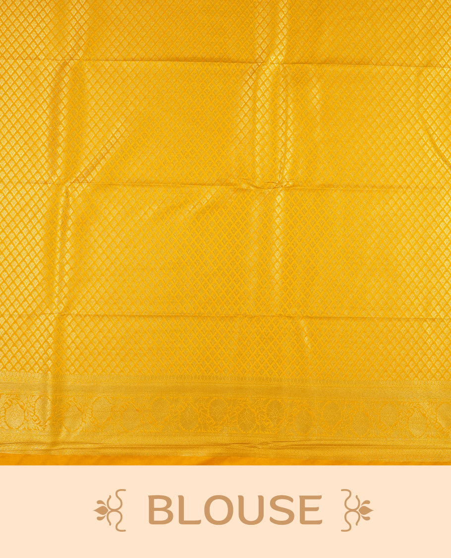 Yellow colour semi silk brocade saree featuring intricate Gold butta patterns across the body, complemented by a rich self colour woven border and pallu, paired with a matching blouse.