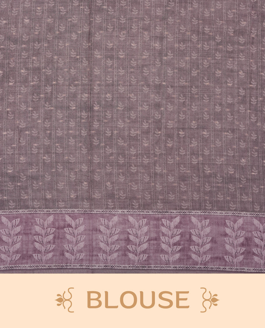 Pink copper colour semi tussar saree adorned with Cream Zigzag printed pattern across the body and Leaf pattern on contrast Dusty pink colour border, paired with a matching blouse.