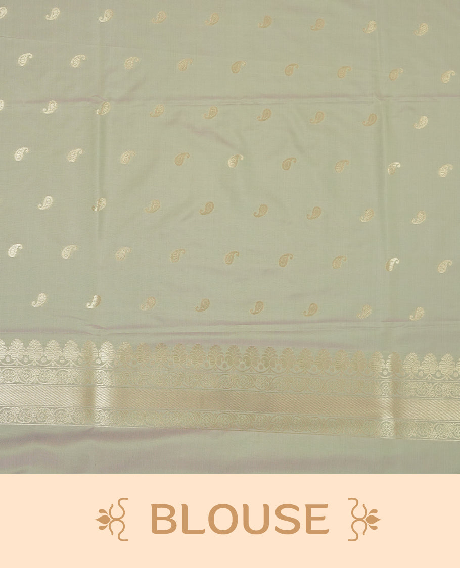 Pastel green colour semi soft silk saree featuring an all-over woven leaf pattern in gold colour, finished with a matching border adorned with detailed paisley and floral motifs, and a matching blouse piece.