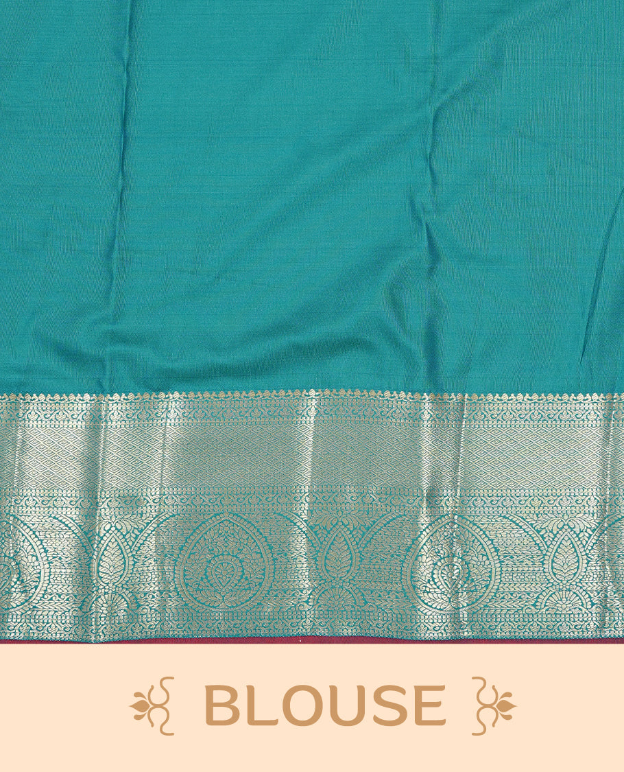 Green colour semi wedding silk saree featuring Gold zari floral kodi pattern on body, complemented by Traditional zari on self colour with Maroon piping, paired with matching blouse piece.